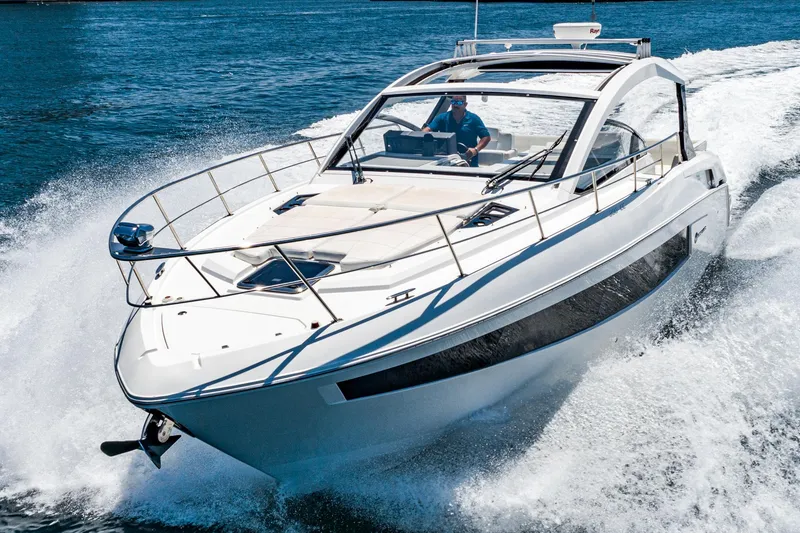 Slide: The Image of 2017 Cruisers Yachts 390 Express Coupe speeding on water. - 4
