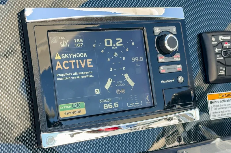 Slide: The Image of 2017 Cruisers Yachts 390 Express Coupe dashboard with Skyhook system active. - 40