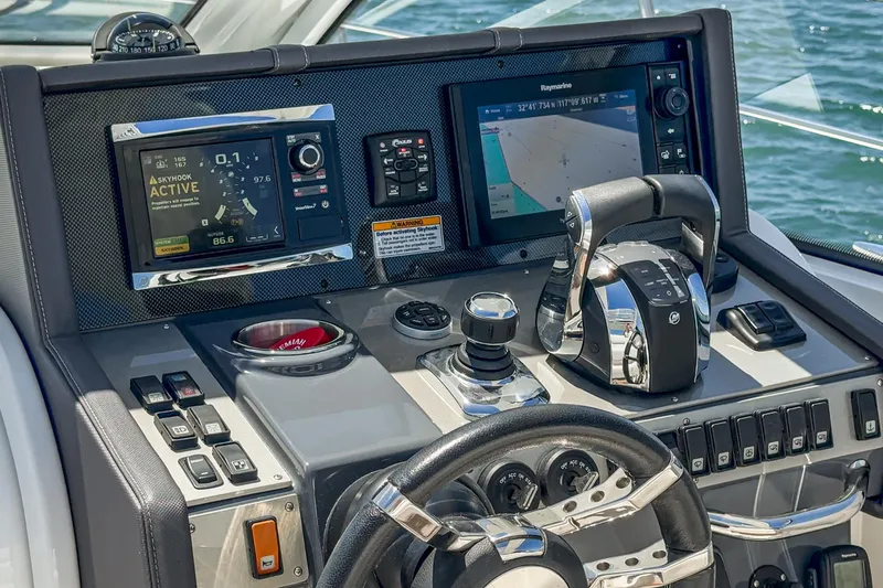 Slide: The Image of 2017 Cruisers Yachts 390 Express Coupe helm with navigation and control systems. - 42