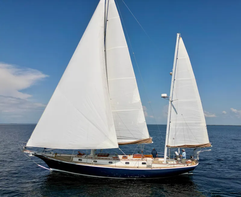 Slide: The Image of 1986 Cherubini 44 sailboat cruising on open water. - 1