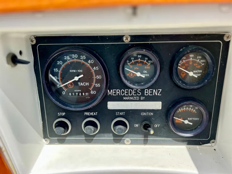 Slide: The Image of 1986 Cherubini 44 boat dashboard with Mercedes Benz engine gauges and controls. - 27