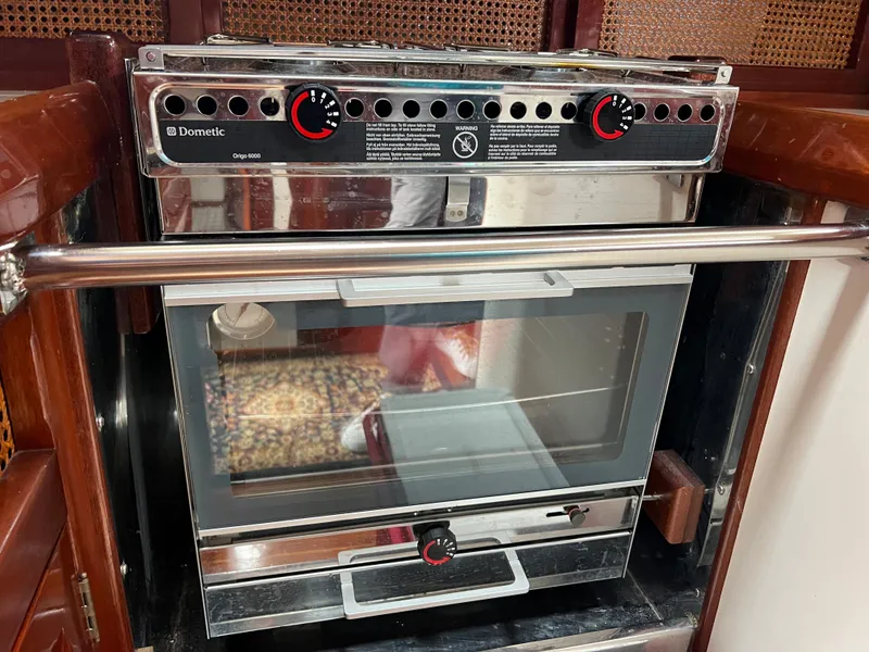Slide: The Image of Dometic stove and oven in a 1986 Cherubini 44 yacht galley. - 45