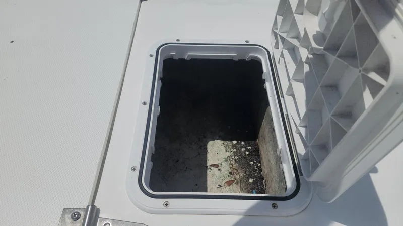 Slide: The Image of Open storage compartment on a 1976 Boston Whaler 17 Montauk boat. - 23