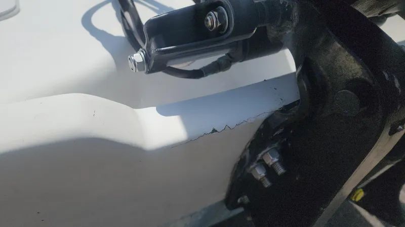 Slide: The Image of Close-up of a 1976 Boston Whaler 17 Montauk boat detail, showing hardware and surface wear. - 25