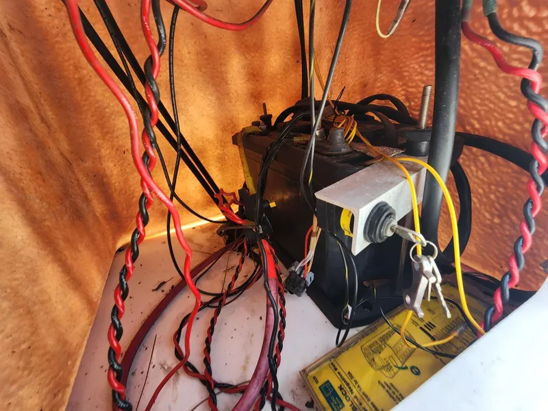 Slide: The Image of Electrical wiring and battery setup inside a 1976 Boston Whaler 17 Montauk boat. - 30