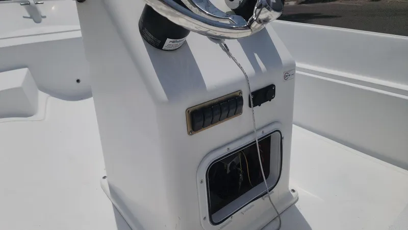 Slide: The Image of 1976 Boston Whaler 17 Montauk boat console with steering wheel and control panel. - 37