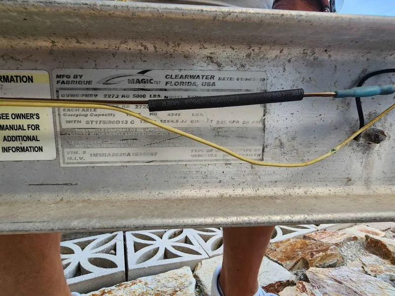 Slide: The Image of Close-up of a 1976 Boston Whaler 17 Montauk boat identification plate. - 9