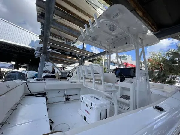 Slide: The Image of 2022 Sea Hunt Ultra 229 boat interior with seating and console. - 5