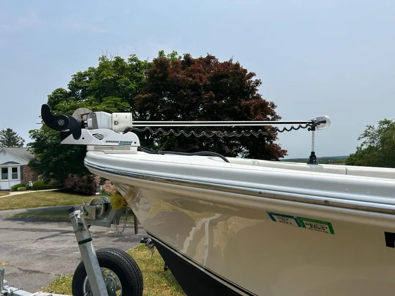 Slide: The Image of 2012 Onslow Bay 20 boat with trolling motor, parked outdoors on a sunny day. - 14