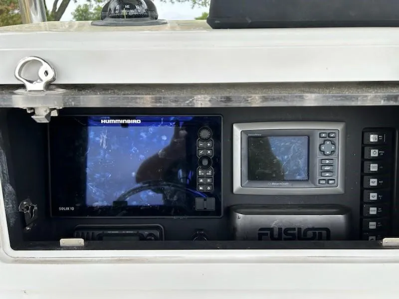 Slide: The Image of Control panel of a 2012 Onslow Bay 20 boat with Humminbird electronics. - 9