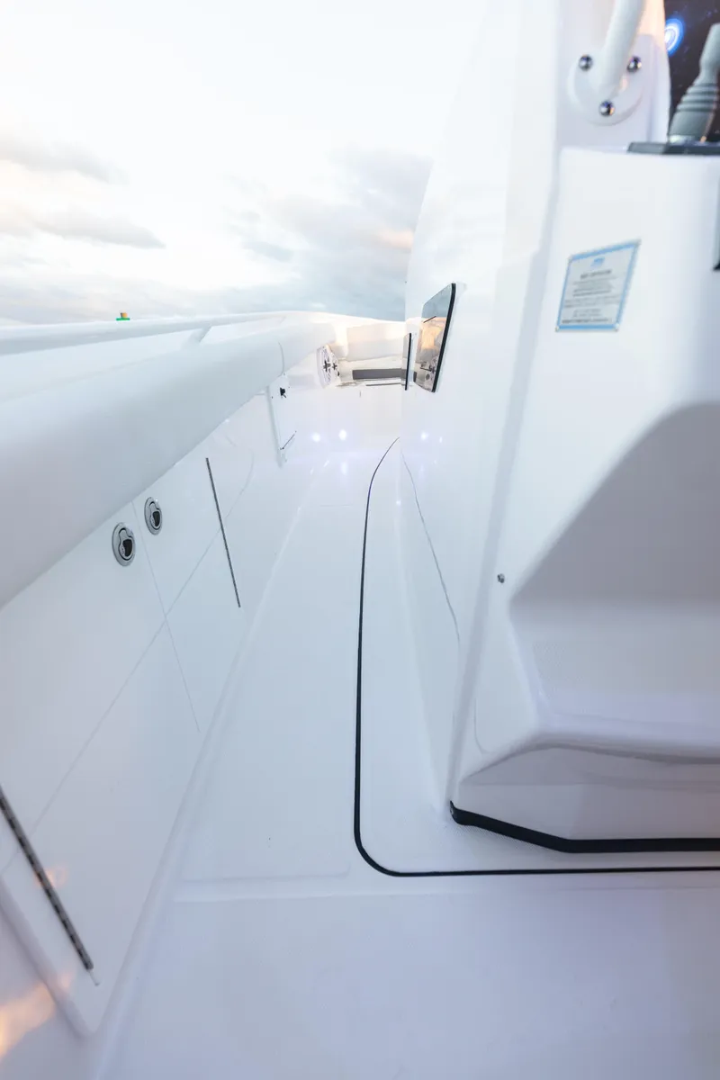 Slide: The Image of 2024 Edgewater 370CC boat deck with sleek white design and modern features. - 10