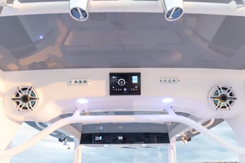 Slide: The Image of 2024 Edgewater 370CC boat console with speakers and electronic display. - 13