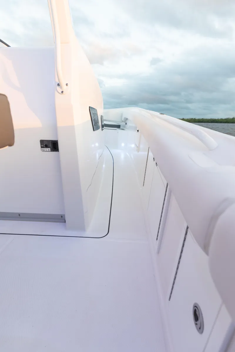 Slide: The Image of 2024 Edgewater 370CC boat deck with sleek white design. - 19