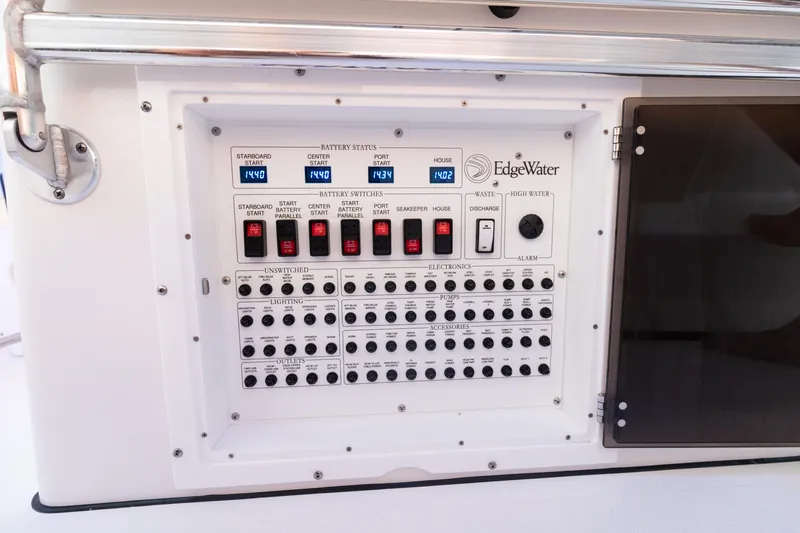 Slide: The Image of 2024 Edgewater 370CC control panel with switches and circuit breakers. - 20