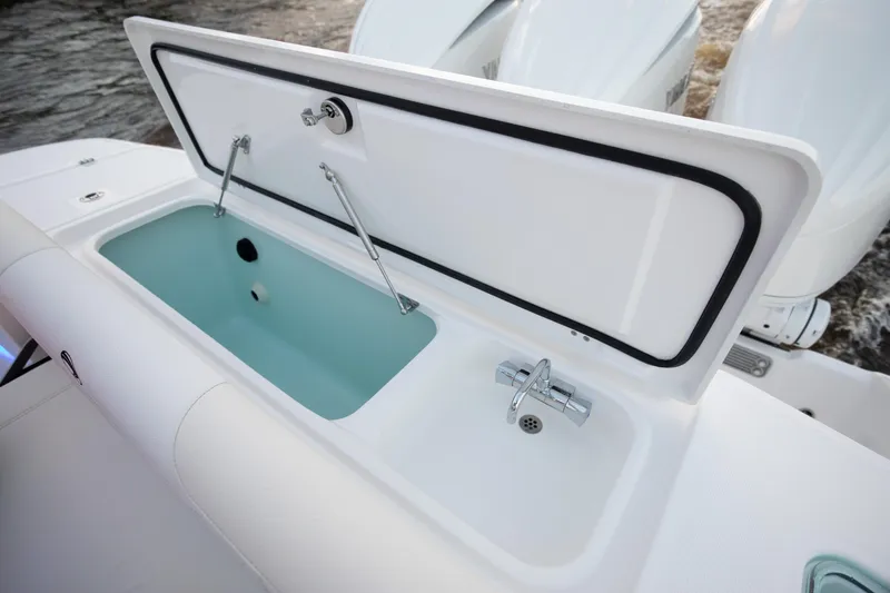 Slide: The Image of 2024 Edgewater 370CC boat livewell and storage compartment. - 25
