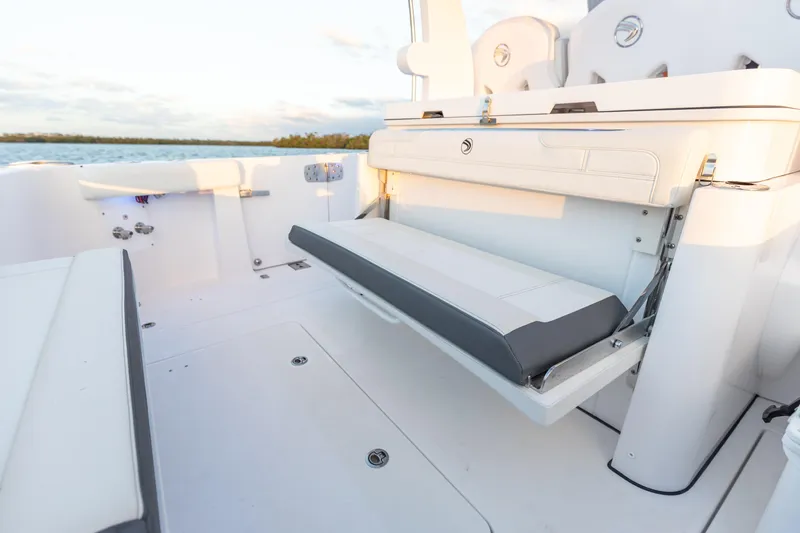 Slide: The Image of 2024 Edgewater 370CC boat with foldable seating in the cockpit area. - 28