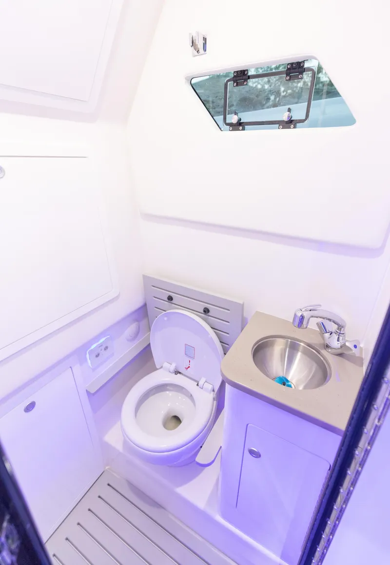 Slide: The Image of 2024 Edgewater 370CC boat interior bathroom with toilet and sink - 31