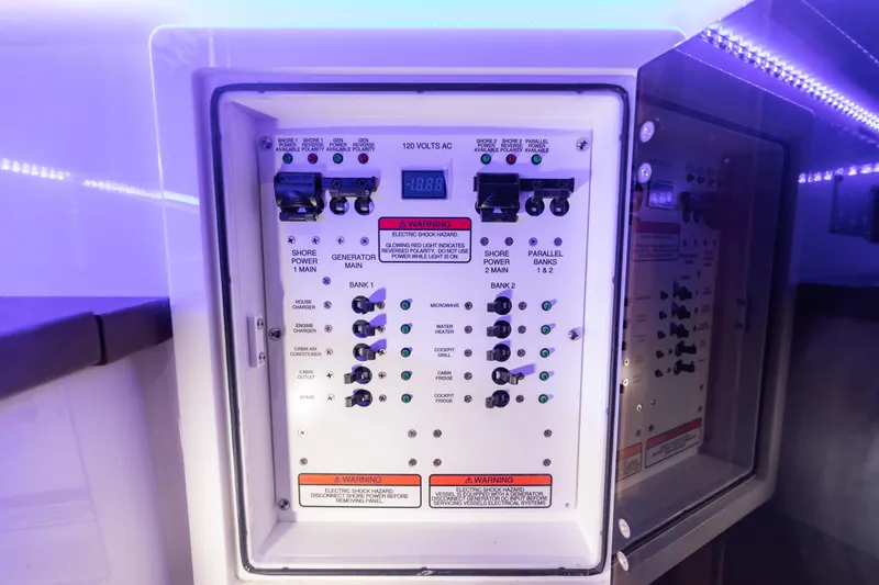 Slide: The Image of Electrical control panel of 2024 Edgewater 370CC boat with illuminated indicators. - 32