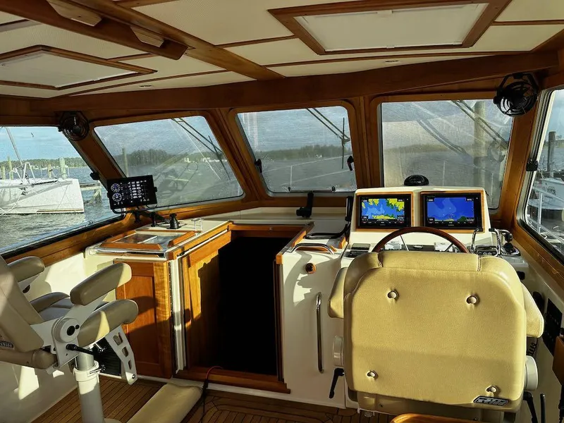 Slide: The Image of Interior of 2008 Sabre 42 Hard Top Express yacht with navigation equipment and seating. - 12