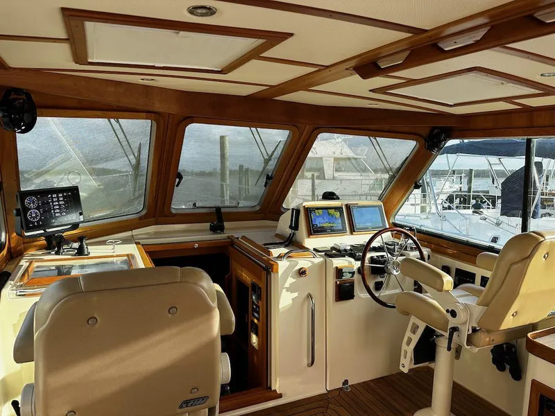 Slide: The Image of 2008 Sabre 42 Hard Top Express helm with navigation equipment and luxurious seating. - 13
