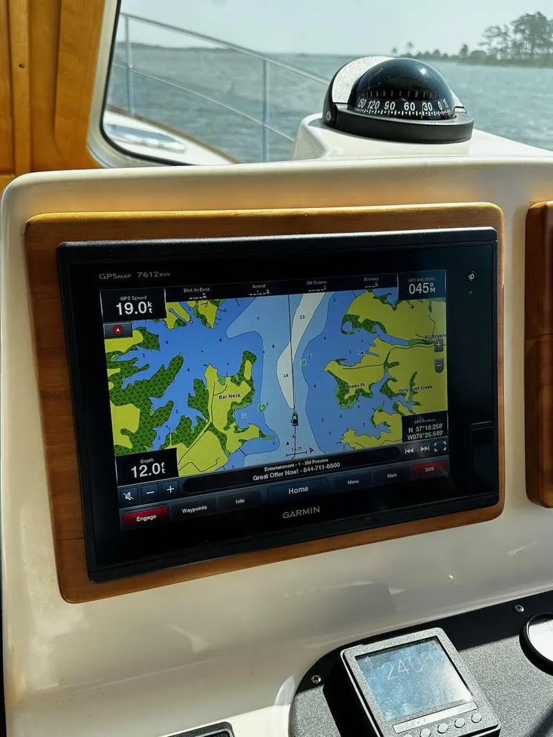 Slide: The Image of Navigation system on 2008 Sabre 42 Hard Top Express boat, displaying a detailed marine map. - 15