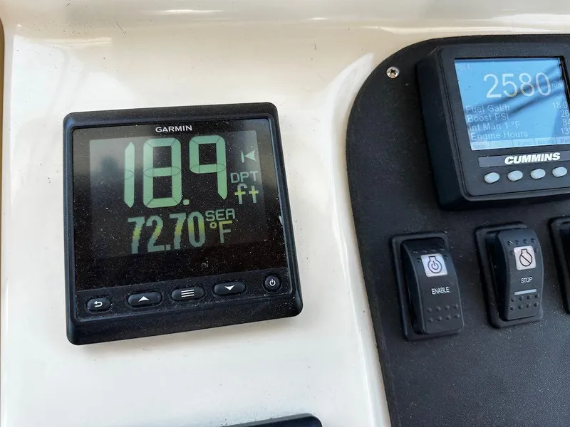 Slide: The Image of Garmin and Cummins displays on 2008 Sabre 42 Hard Top Express dashboard. - 17