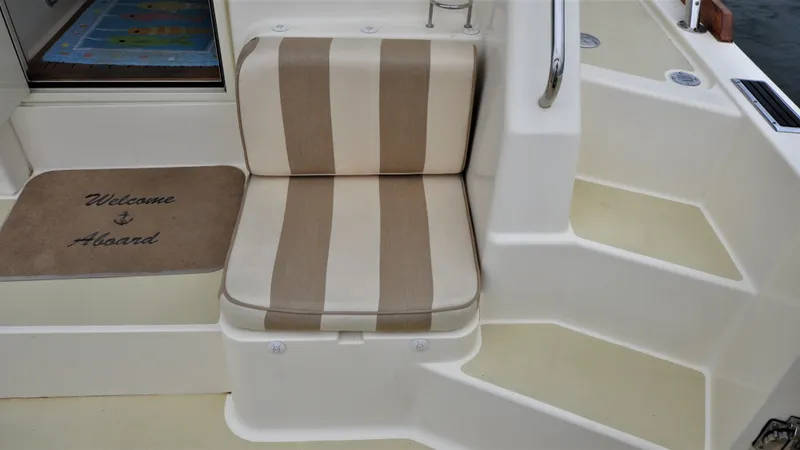 Slide: The Image of Striped seat and welcome mat on 2008 Sabre 42 Hard Top Express yacht. - 27
