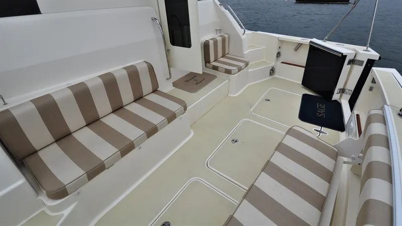Slide: The Image of 2008 Sabre 42 Hard Top Express boat with striped seating in the cockpit area. - 29