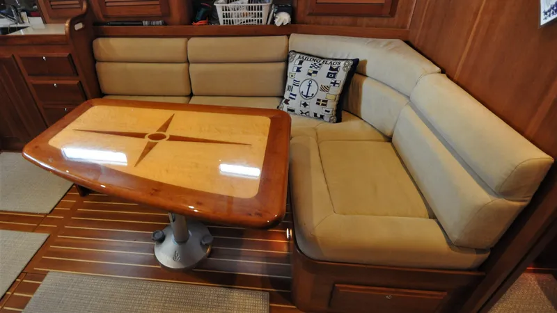 Slide: The Image of Luxurious interior of 2008 Sabre 42 Hard Top Express with plush seating and elegant wooden table. - 37