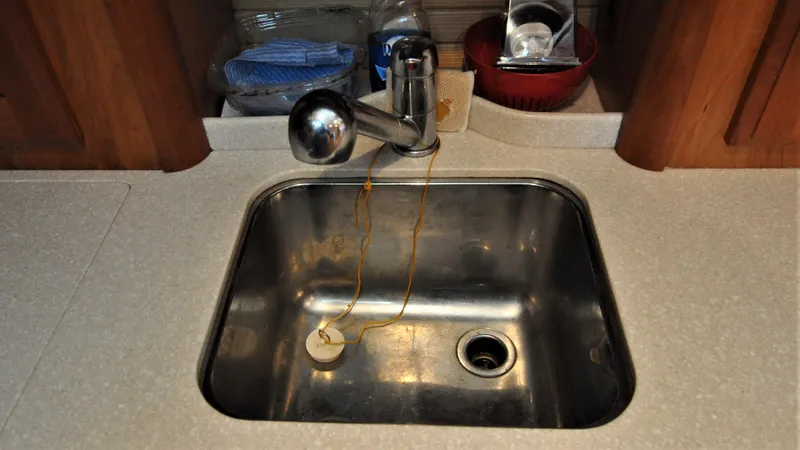 Slide: The Image of Stainless steel sink in 2008 Sabre 42 Hard Top Express yacht kitchen. - 48