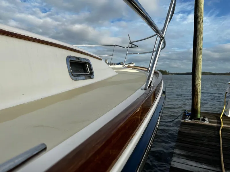 Slide: The Image of 2008 Sabre 42 Hard Top Express yacht docked by the water. - 7