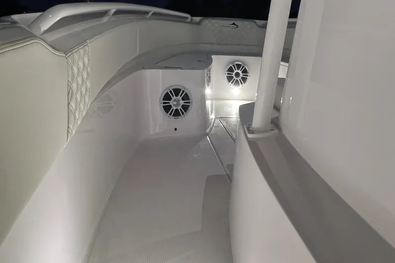 Slide: The Image of 2022 Streamline 26TE boat interior with illuminated speakers and cushioned seating. - 12