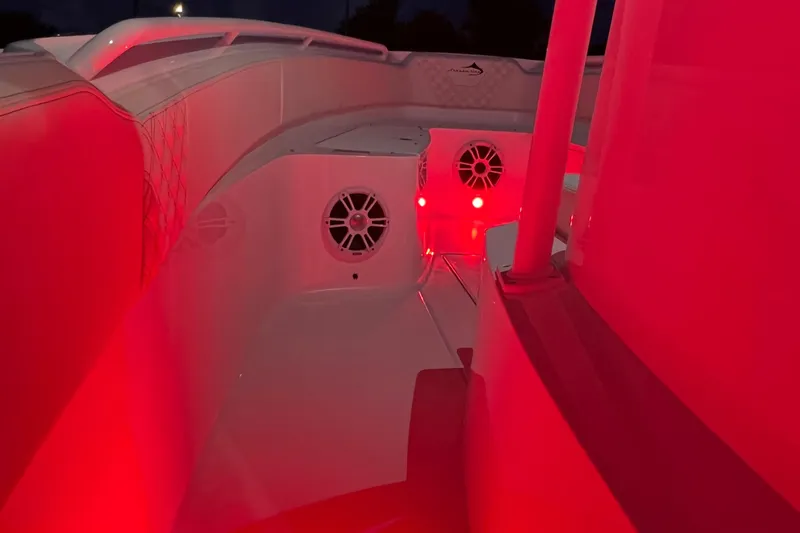 Slide: The Image of 2022 Streamline 26TE boat interior with red LED lighting and speakers. - 14