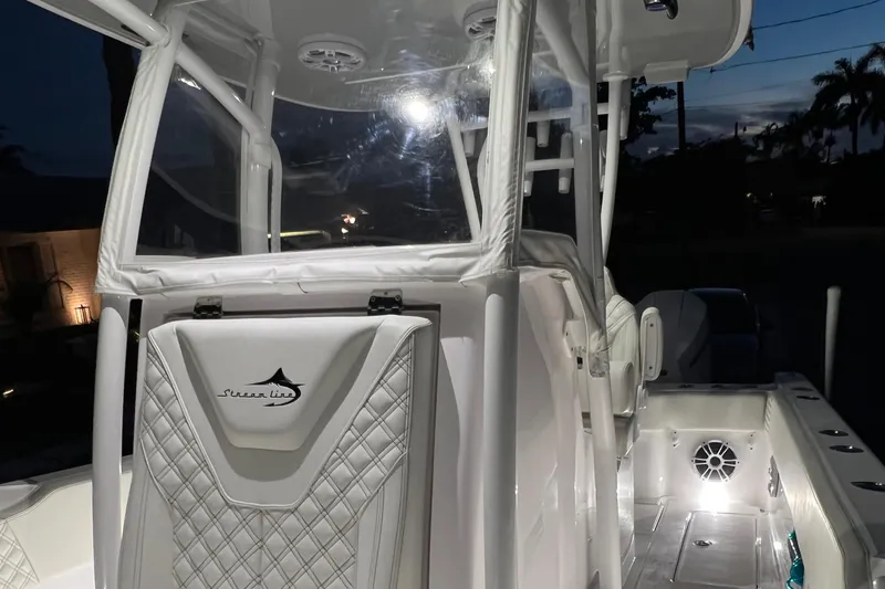 Slide: The Image of 2022 Streamline 26TE boat interior at night with illuminated deck. - 6