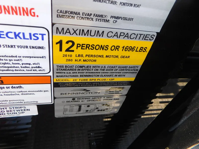 Slide: The Image of Bennington 23RSBA 2023 boat capacity label, 12 persons or 1696 lbs, 260 HP motor. - 10