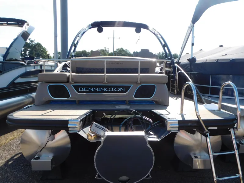 Slide: The Image of 2023 Bennington 23RSBA pontoon boat, rear view with sleek design and modern features. - 3