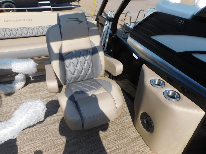 Slide: The Image of 2023 Bennington 23RSBA boat interior with luxury seating and modern console design. - 8