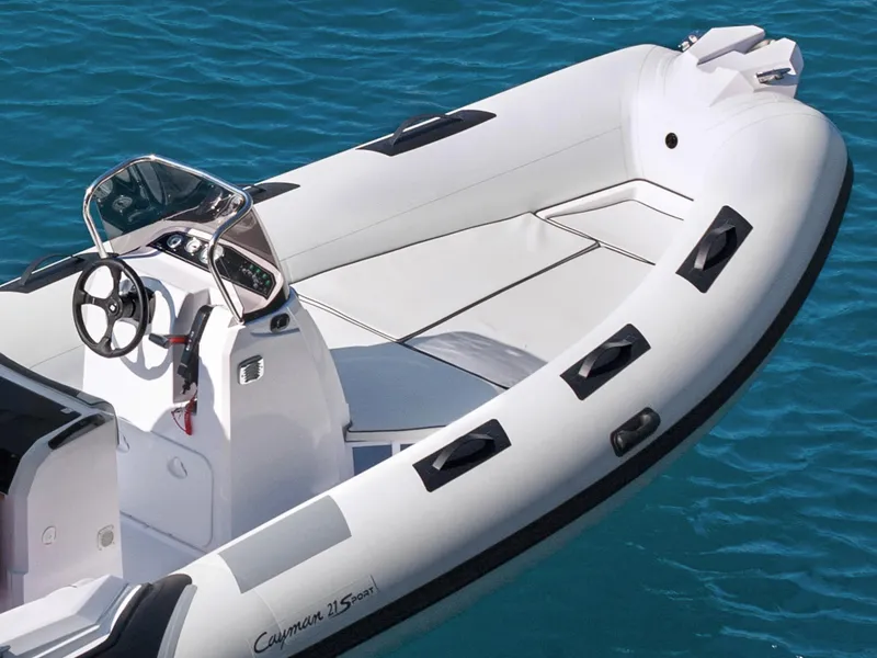 Slide: The Image of 2023 Ranieri CAYMAN 21 SPORT boat on clear blue water. - 11