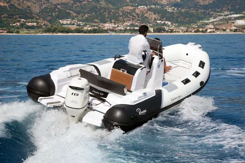 Slide: The Image of 2023 Ranieri CAYMAN 21 SPORT boat cruising on the water. - 5