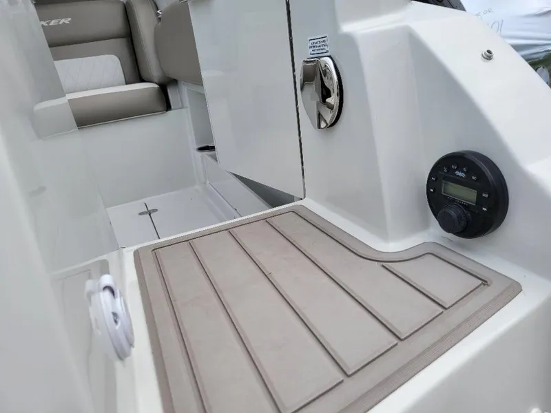Slide: The Image of 2024 Finseeker 280 DC boat interior, featuring seating and control panel. - 14