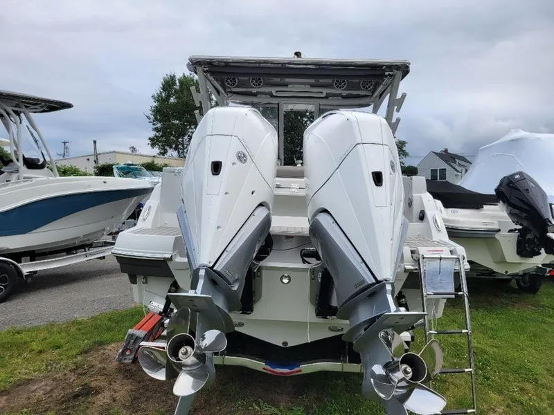 Slide: The Image of 2024 Finseeker 280 DC boat with dual outboard engines, rear view. - 18