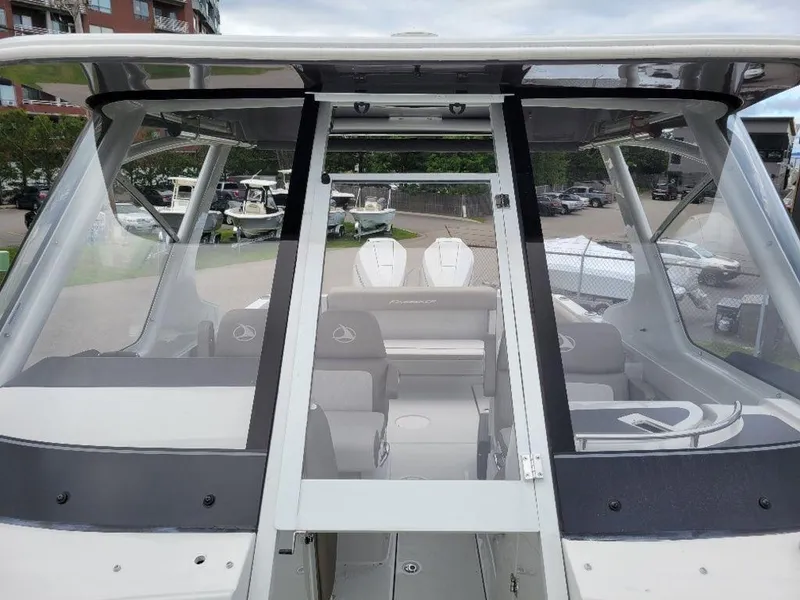Slide: The Image of 2024 Finseeker 280 DC boat interior view with seating and dashboard. - 3