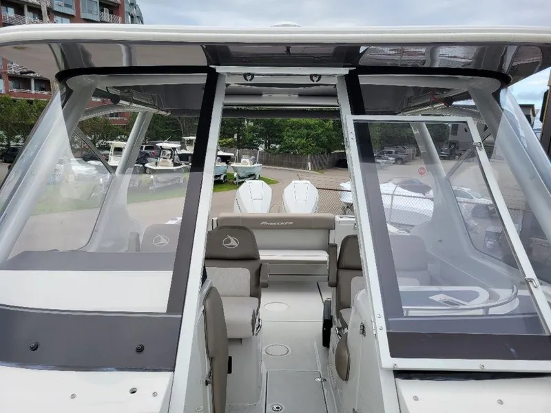 Slide: The Image of 2024 Finseeker 280 DC boat interior with seating and windshield. - 4
