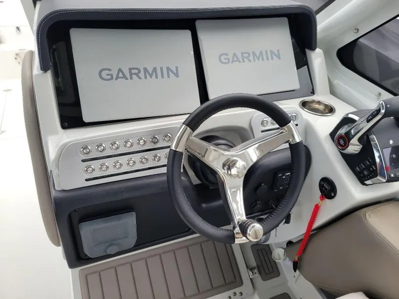Slide: The Image of 2024 Finseeker 280 DC helm with dual Garmin displays and modern controls. - 9