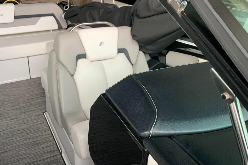 Slide: The Image of 2019 Four Winns H290 OB boat interior with plush seating and modern design. - 13