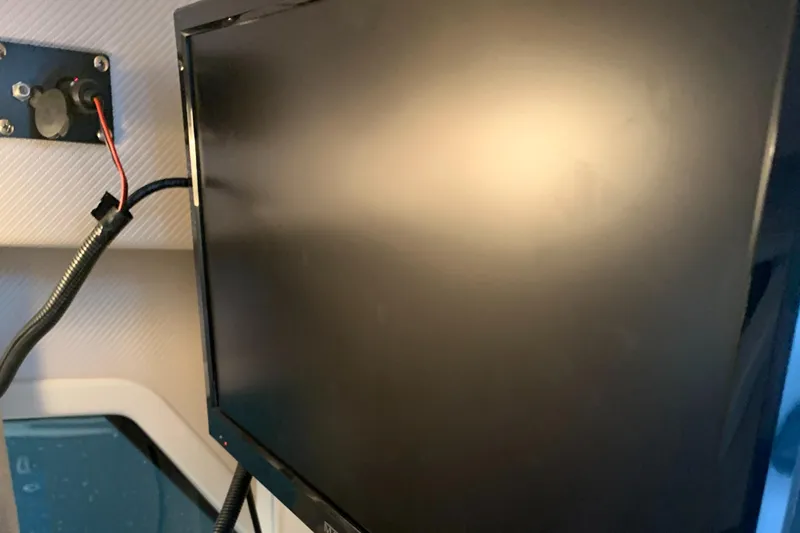 Slide: The Image of Boat interior with a mounted monitor, Four Winns H290 OB, 2019 model. - 20