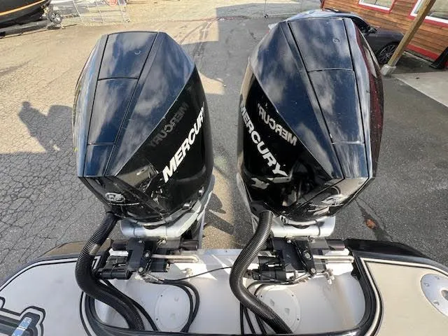 Slide: The Image of Twin Mercury outboard engines on a 2019 Four Winns H290 OB boat. - 36