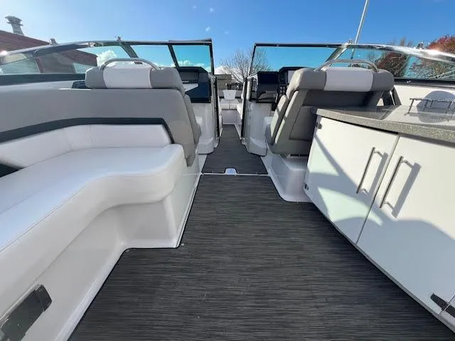 Slide: The Image of 2019 Four Winns H290 OB boat interior with sleek seating and modern design. - 38