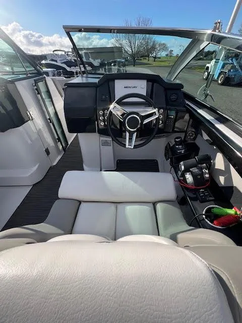 Slide: The Image of 2019 Four Winns H290 OB boat cockpit with modern steering and controls. - 40