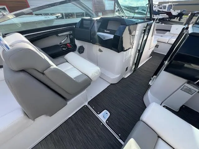 Slide: The Image of 2019 Four Winns H290 OB boat interior with modern seating and dashboard. - 41
